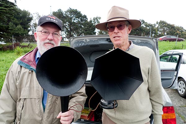 men with horn speakers