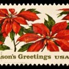 22-cent USA stamp with poinsettias, reads "Season's Greetings"